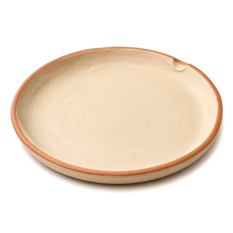 A hand-molded clay plate, empty and ready.